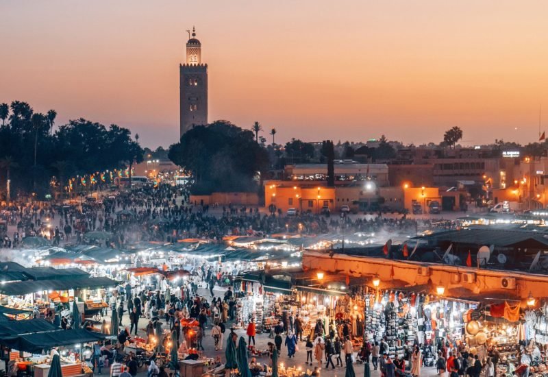 An aerial view of the Djemaa el Fna Marketplace illuminated at night