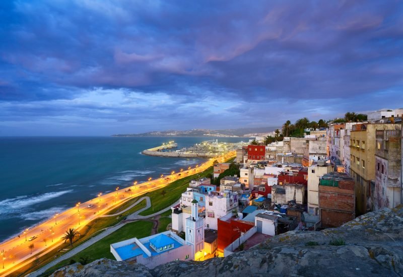 An aerial view of cityscape Tangier surrounded by buildings and water